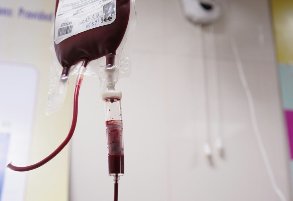 a blood test tube with a blood dropper attached to it